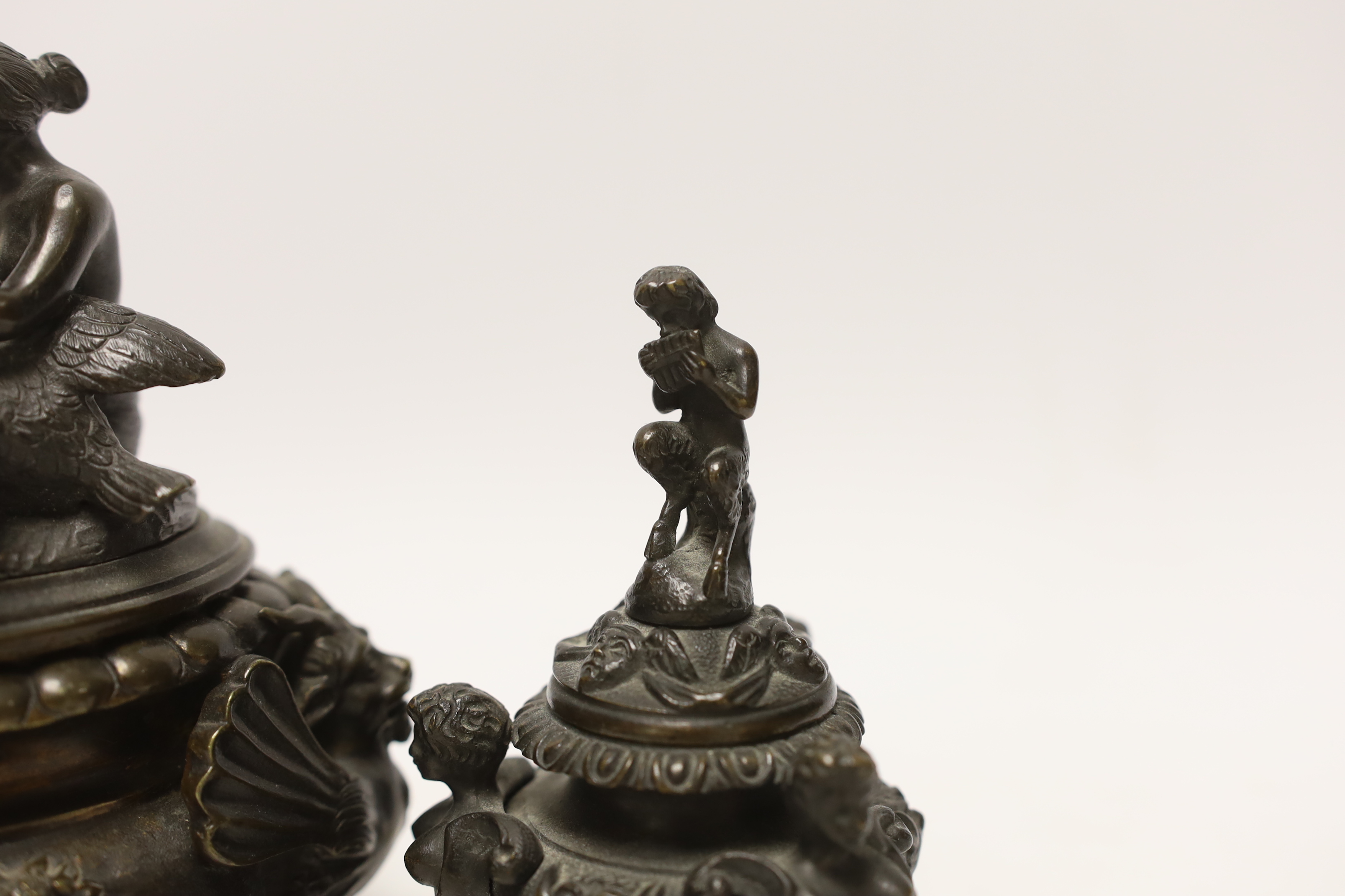A classical revival bronze Leda and the swan vessel and a Pan playing the pipes inkwell